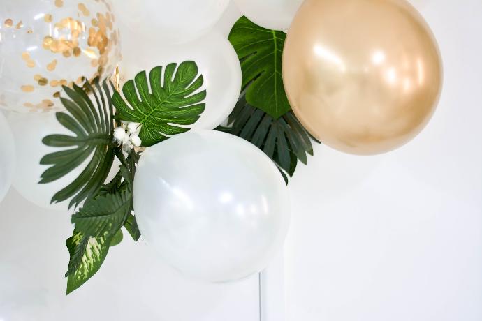 two gold and white balloons